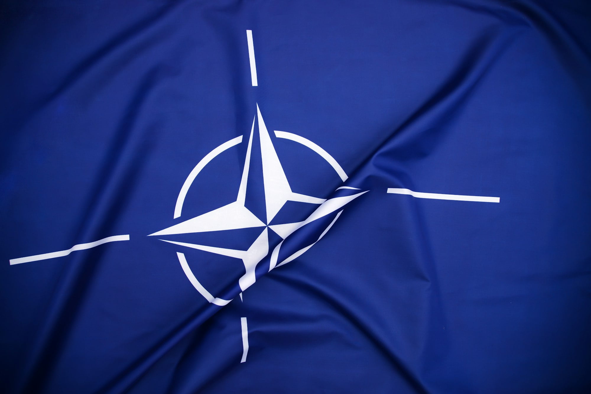 NATO flag.North Atlantic Treaty Organization flag waving.